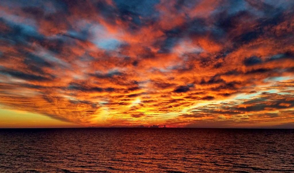 Dramatic orange sunset sky over the Gulf